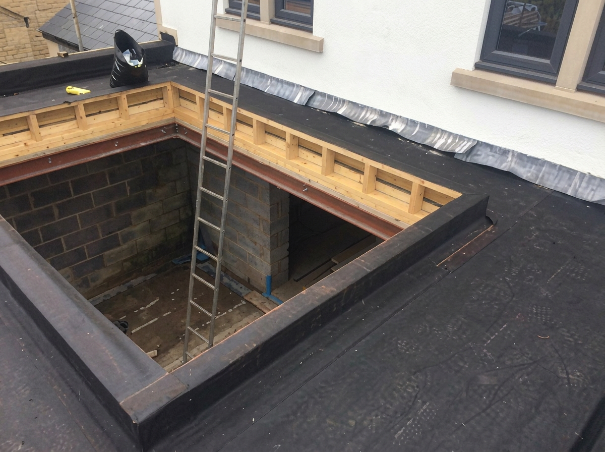EPDM flat roof detail formed neatly around a lightwell opening